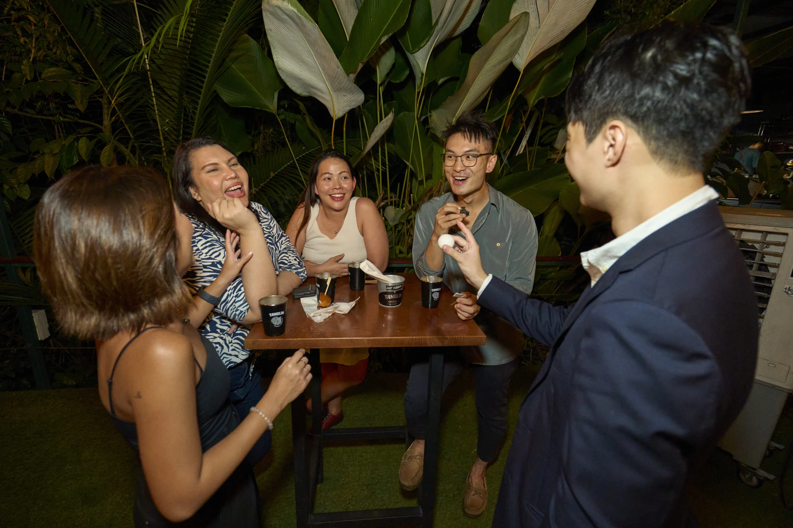 Ryan Goh performing close-up magic for guests