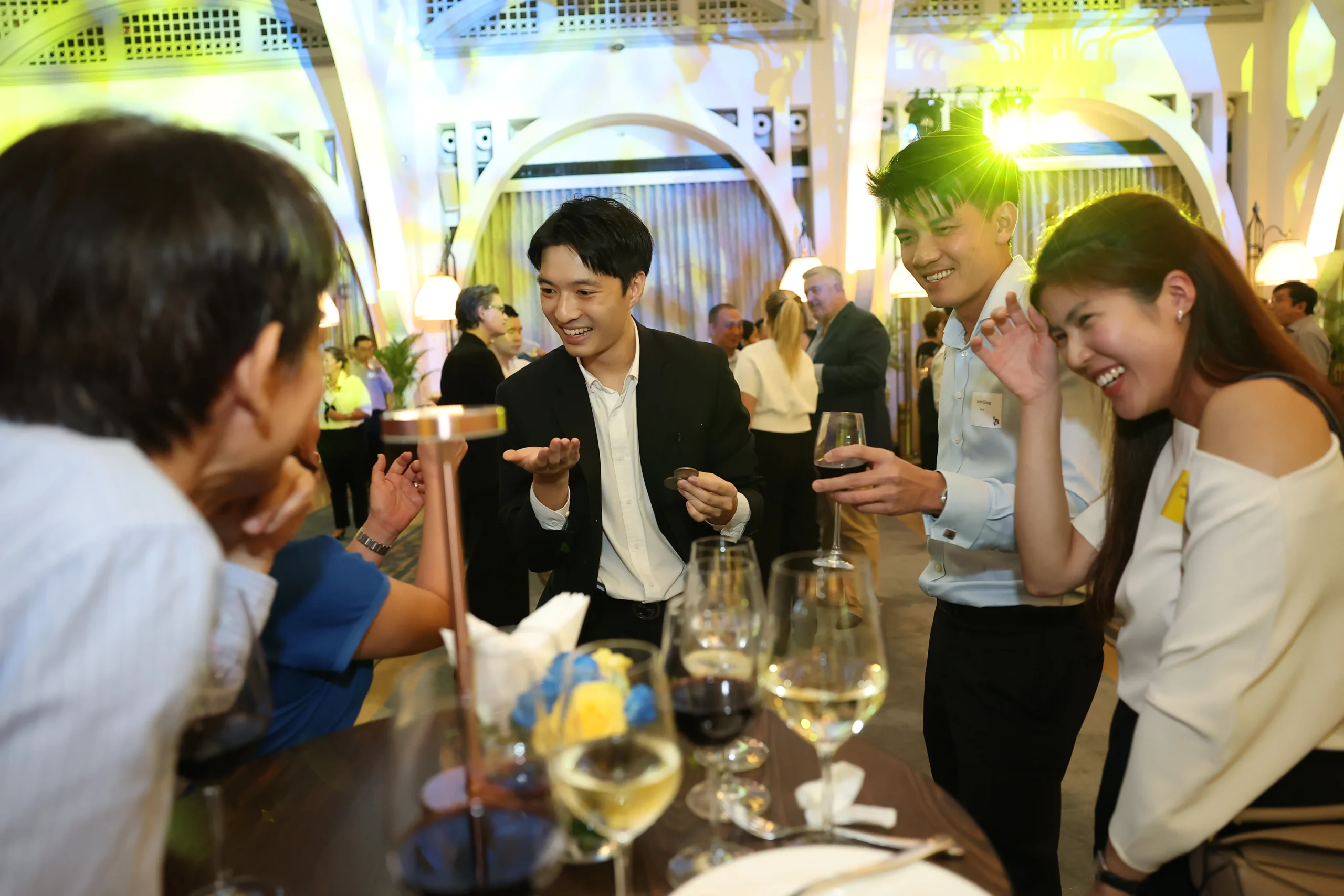 Close-up magician Ryan Goh performing sleight of hand for guests in Singapore